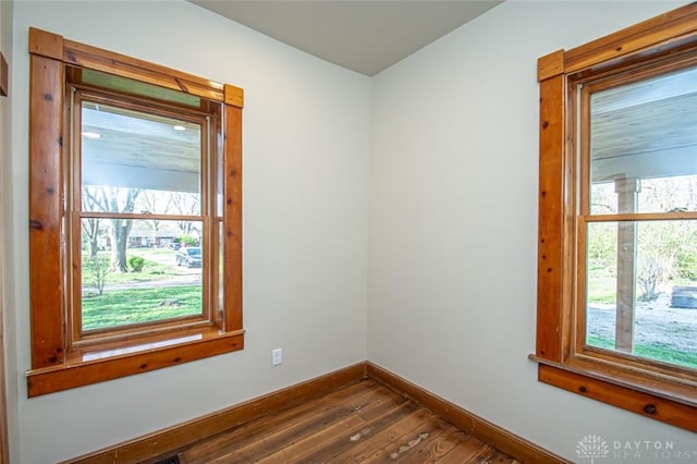 117 Montgomery Ave, Franklin, OH 45005 - empty room with baseboards, dark wood-style floors, and a wealth of natural light