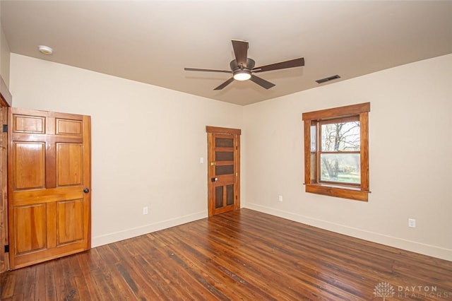 117 Montgomery Ave, Franklin, OH 45005 - unfurnished room with visible vents, a ceiling fan, baseboards, and dark wood-type flooring