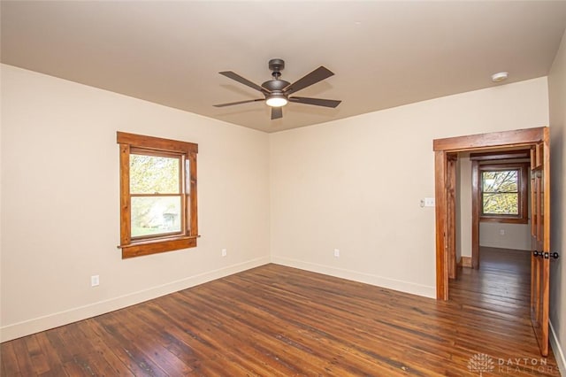 117 Montgomery Ave, Franklin, OH 45005 - spare room with dark wood finished floors, baseboards, ceiling fan, and plenty of natural light