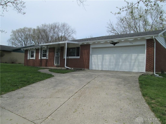 single story home with concrete driveway, brick siding, a front yard, and a garage
