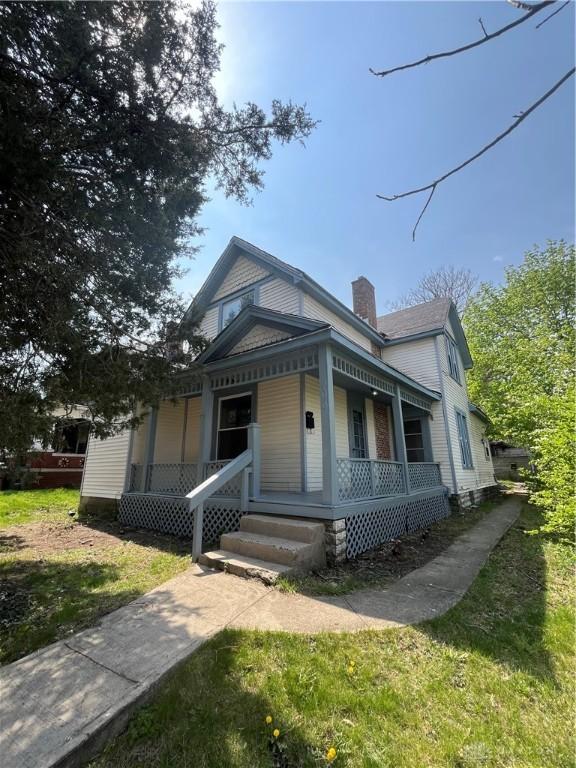 400 S Detroit St, Xenia, OH 45385 - view of front of property with covered porch and a chimney