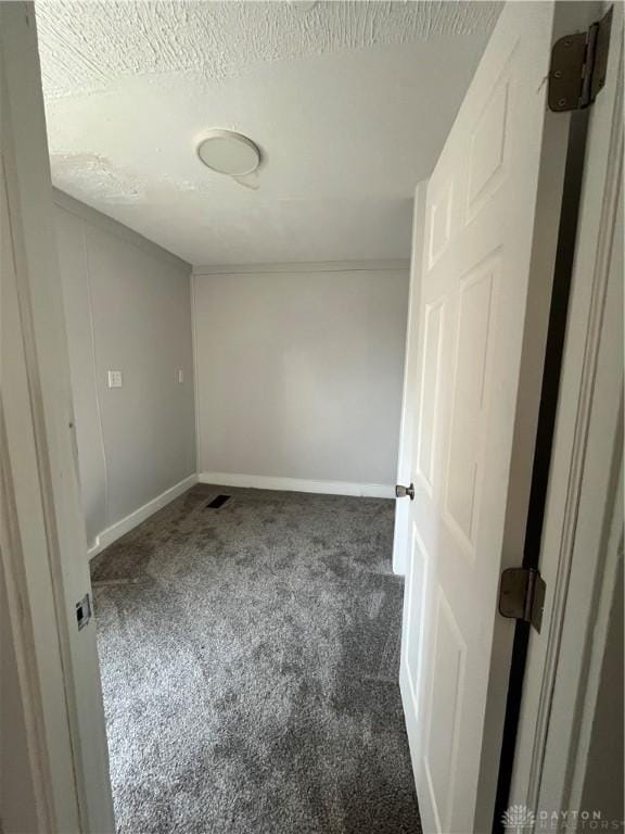 400 S Detroit St, Xenia, OH 45385 - empty room featuring carpet, baseboards, and a textured ceiling