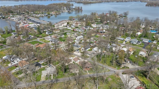 drone / aerial view with a water view and a residential view