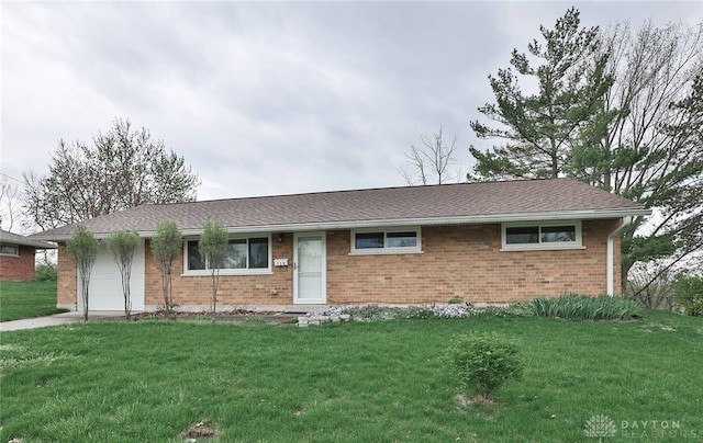 320 Orangewood Dr, Dayton, OH 45429 - ranch-style home featuring brick siding, an attached garage, and a front yard