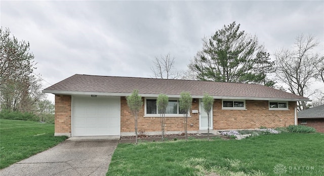 320 Orangewood Dr, Dayton, OH 45429 - single story home featuring an attached garage, a front lawn, driveway, and brick siding