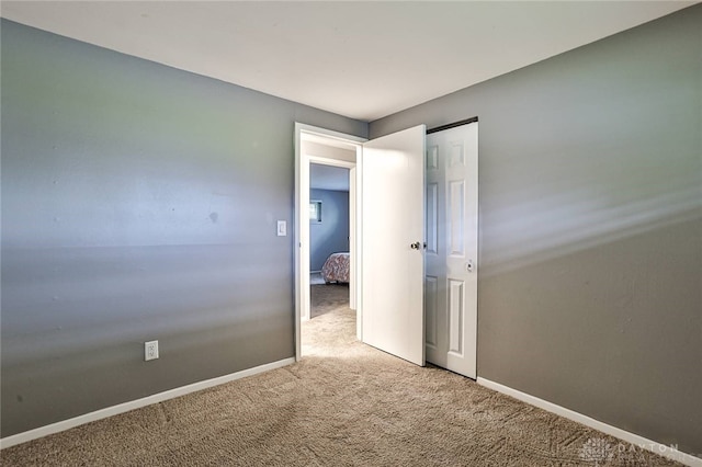 320 Orangewood Dr, Dayton, OH 45429 - unfurnished bedroom with baseboards, carpet flooring, and a closet