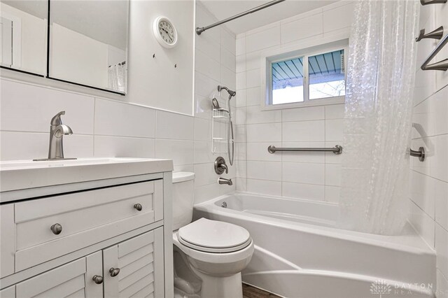 320 Orangewood Dr, Dayton, OH 45429 - bathroom featuring tile walls, shower / tub combo, toilet, and vanity