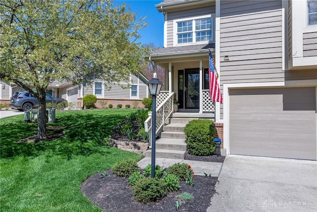 view of front facade featuring a garage, a front lawn, and concrete driveway