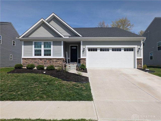 2408 Valleybrook Ct, Batavia, OH 45103 - craftsman inspired home featuring a front lawn, driveway, stone siding, and a garage