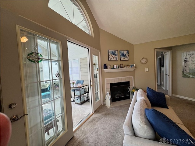 9632 Belfry Ct, Dayton, OH 45458 - living room featuring light colored carpet, baseboards, vaulted ceiling, and a tiled fireplace