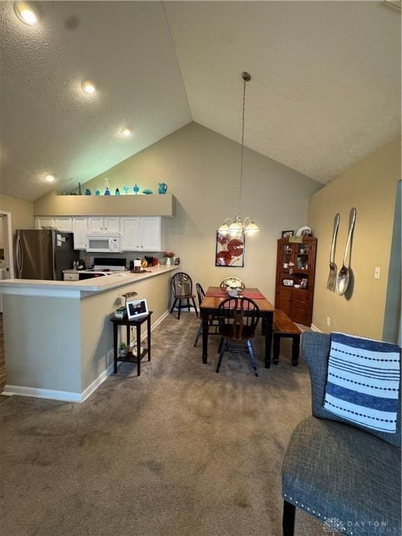 9632 Belfry Ct, Dayton, OH 45458 - carpeted dining area with lofted ceiling, an inviting chandelier, and baseboards