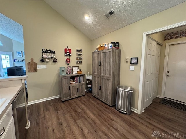 9632 Belfry Ct, Dayton, OH 45458 - interior space with baseboards, vaulted ceiling, visible vents, and dark wood-style flooring