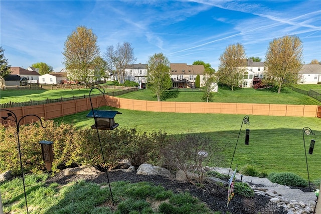 view of yard with fence and a residential view