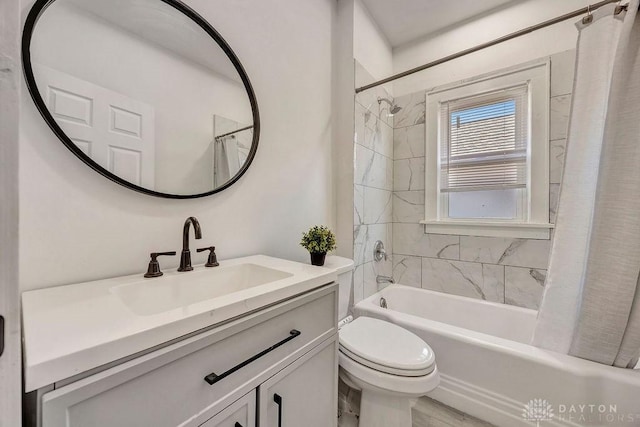 full bathroom featuring toilet, vanity, and shower / bath combination with curtain