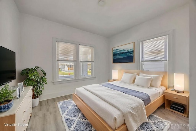 bedroom with light wood-style floors