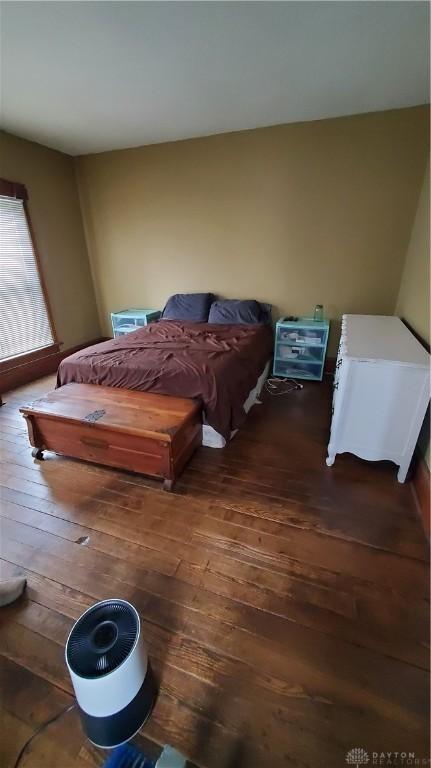 bedroom with wood-type flooring