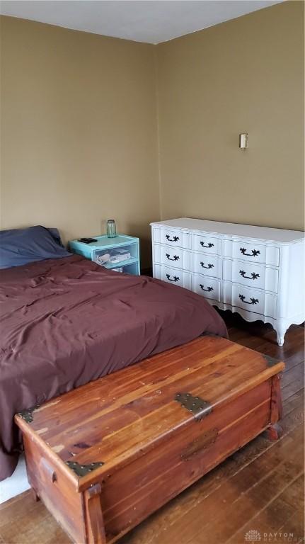 bedroom featuring wood finished floors