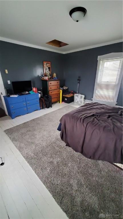 bedroom featuring ornamental molding