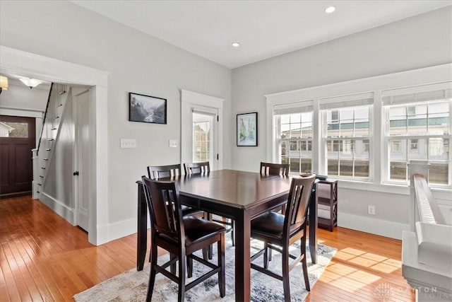 203 W Plum St, Saint Paris, OH 43072 - dining area featuring light wood-style floors, stairway, baseboards, and recessed lighting
