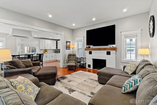 203 W Plum St, Saint Paris, OH 43072 - living area with light wood-style flooring, recessed lighting, and a fireplace