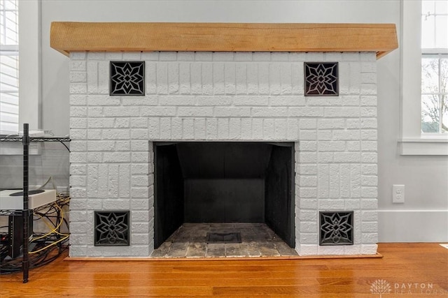 203 W Plum St, Saint Paris, OH 43072 - detailed view of a brick fireplace and wood finished floors