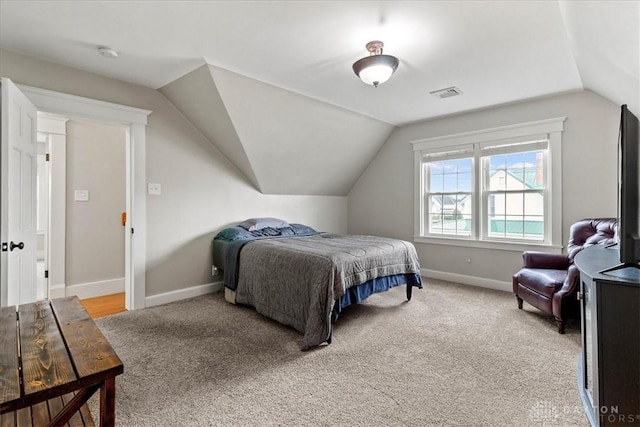 203 W Plum St, Saint Paris, OH 43072 - bedroom featuring light carpet, vaulted ceiling, and baseboards