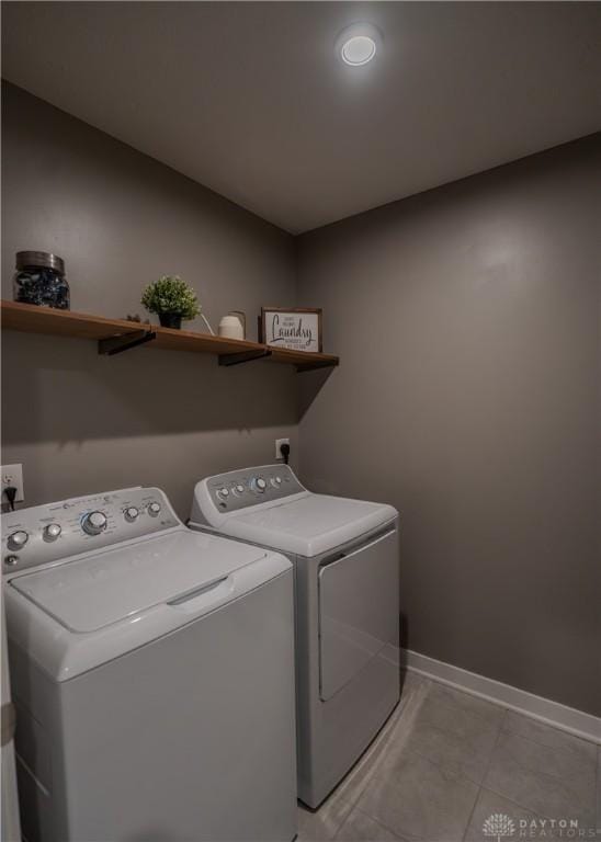 1180 Autumn Ridge Dr, Lebanon, OH 45036 - clothes washing area with separate washer and dryer, baseboards, laundry area, and light tile patterned floors