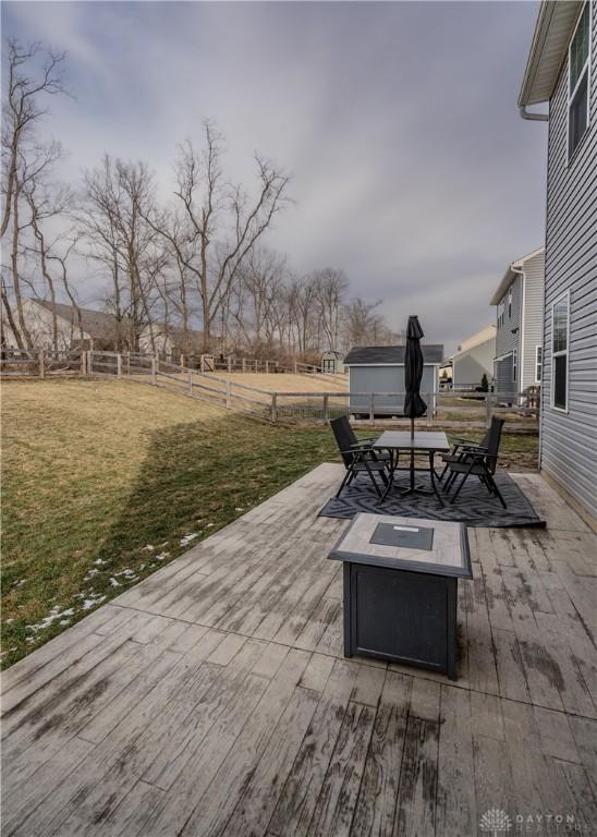 1180 Autumn Ridge Dr, Lebanon, OH 45036 - view of patio / terrace featuring fence, an outdoor fire pit, and a deck