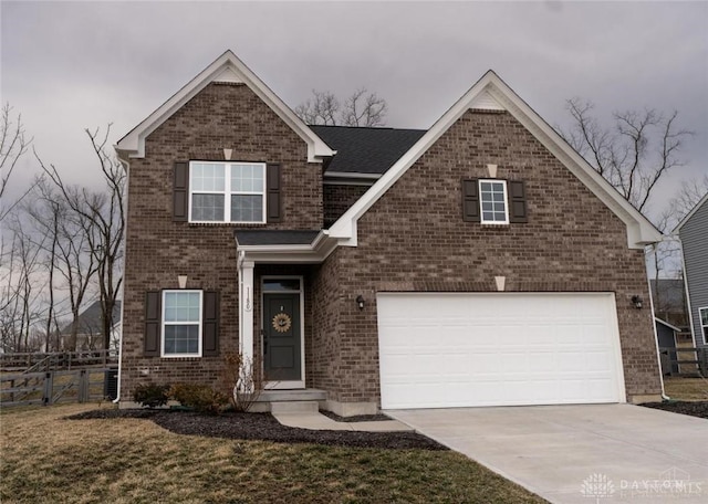1180 Autumn Ridge Dr, Lebanon, OH 45036 - traditional-style home with fence, brick siding, a garage, and concrete driveway