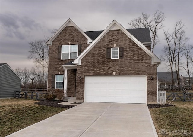 1180 Autumn Ridge Dr, Lebanon, OH 45036 - traditional home featuring concrete driveway, an attached garage, brick siding, and fence