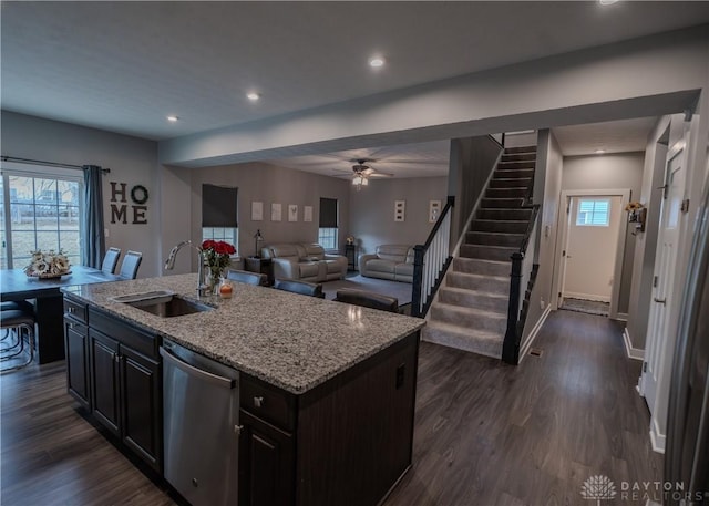 1180 Autumn Ridge Dr, Lebanon, OH 45036 - kitchen featuring light stone counters, a ceiling fan, a sink, dishwasher, and dark wood finished floors