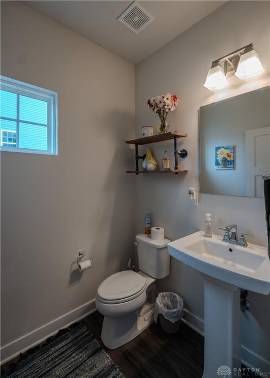 1180 Autumn Ridge Dr, Lebanon, OH 45036 - bathroom with toilet, wood finished floors, visible vents, and baseboards