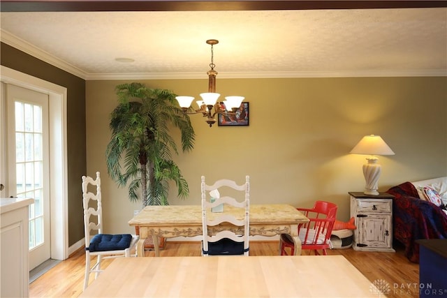 115 Southlake Dr, Dayton, OH 45459 - dining area with a chandelier, light wood-style flooring, and ornamental molding