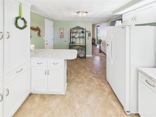 kitchen with a peninsula, white cabinetry, light countertops, white fridge with ice dispenser, and ornamental molding