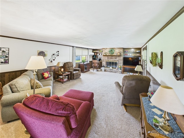 carpeted living area with a fireplace, built in features, and ornamental molding