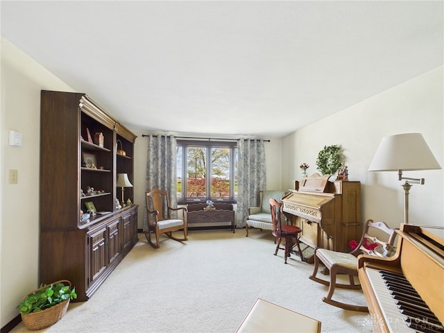 living area with light carpet