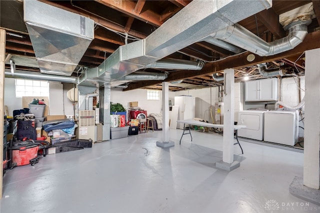 below grade area with independent washer and dryer, a wealth of natural light, and heating unit