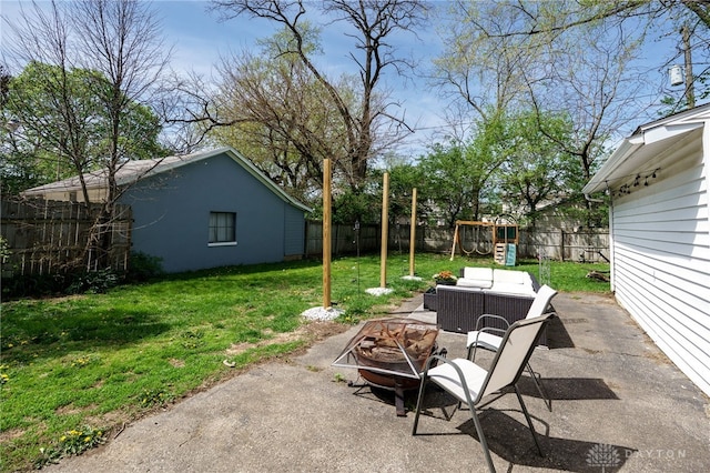 view of yard featuring a patio, a fenced backyard, and a playground