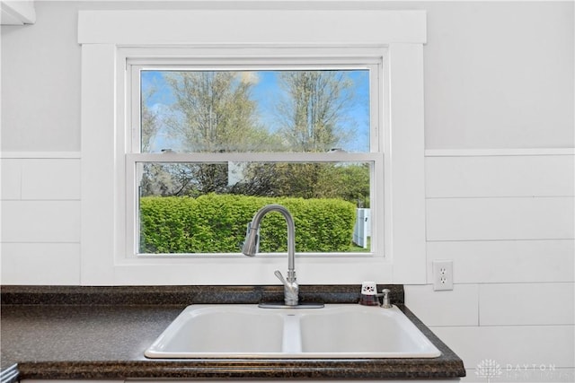 interior details featuring dark countertops and a sink