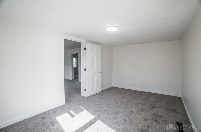 316 5th St, Piqua, OH 45356 - unfurnished room featuring carpet flooring and baseboards