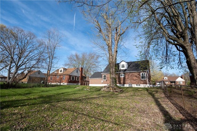 view of yard with a residential view and fence