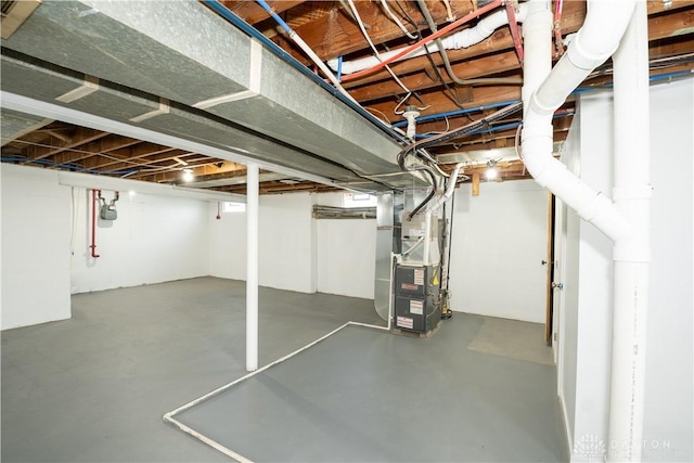 basement featuring heating unit