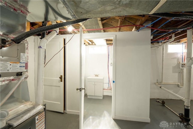 below grade area featuring plenty of natural light and a sink