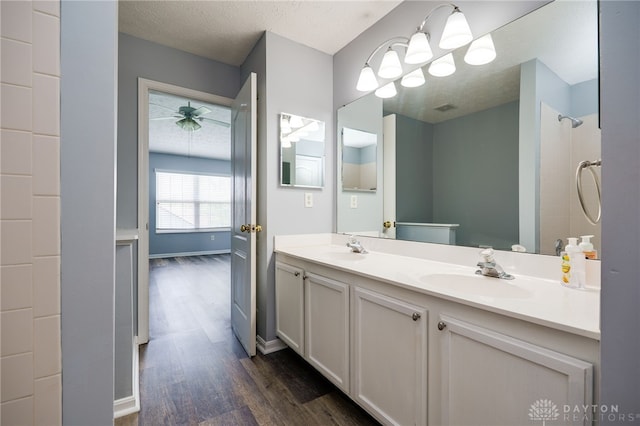2454 Cabbage Key Dr, Miamisburg, OH 45342 - full bath featuring double vanity, wood finished floors, visible vents, and a sink