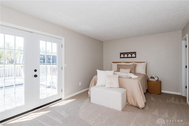 bedroom with carpet floors, french doors, access to exterior, and baseboards