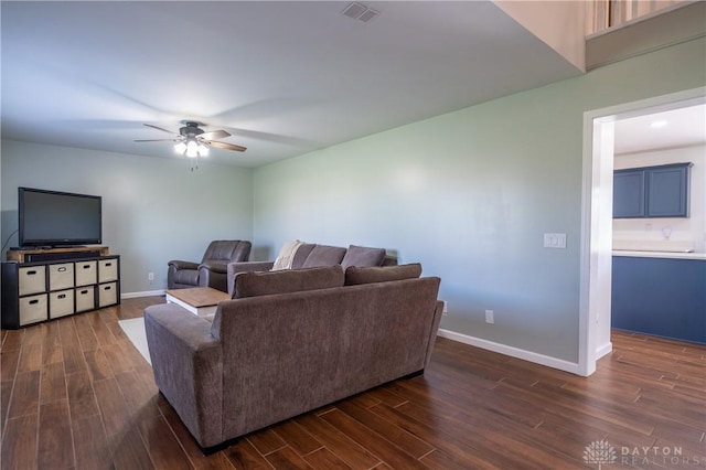 4100 Joshane St, Springfield, OH 45502 - living area with ceiling fan, baseboards, dark wood-type flooring, and visible vents