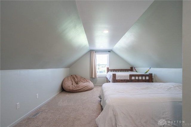 4100 Joshane St, Springfield, OH 45502 - carpeted bedroom with lofted ceiling, visible vents, and baseboards
