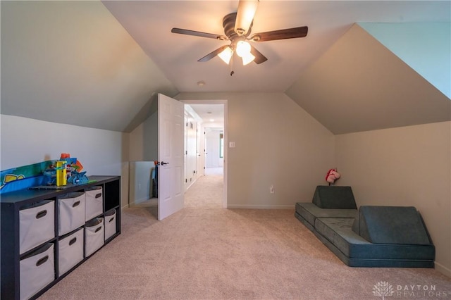 4100 Joshane St, Springfield, OH 45502 - living area with light colored carpet, vaulted ceiling, a ceiling fan, and baseboards