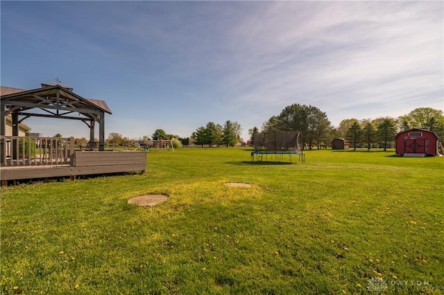 4100 Joshane St, Springfield, OH 45502 - view of yard with an outdoor structure, a storage unit, a gazebo, and a trampoline