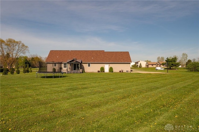 4100 Joshane St, Springfield, OH 45502 - back of house with a yard and a trampoline